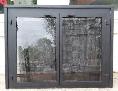 Buzzards Bay (Molding on surround)  All black frame with plain square stock molding,  twin doors with vice bi grip handles, smoked glass. Comes with slide mesh spark screen.